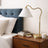 Ornate Brass Ring Base Curved Table Lamp with Triangle White Drum Shade