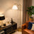 Majestic Brass Ring Base Curved Floor Lamp | Triangle Drum Shade